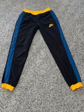 Nike Black Track Pants with Blue Side Panels and Yellow Trim